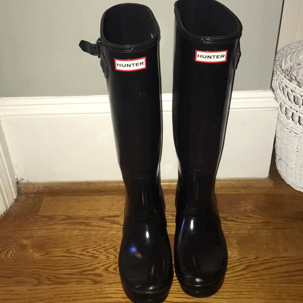 Black tall hunter boots